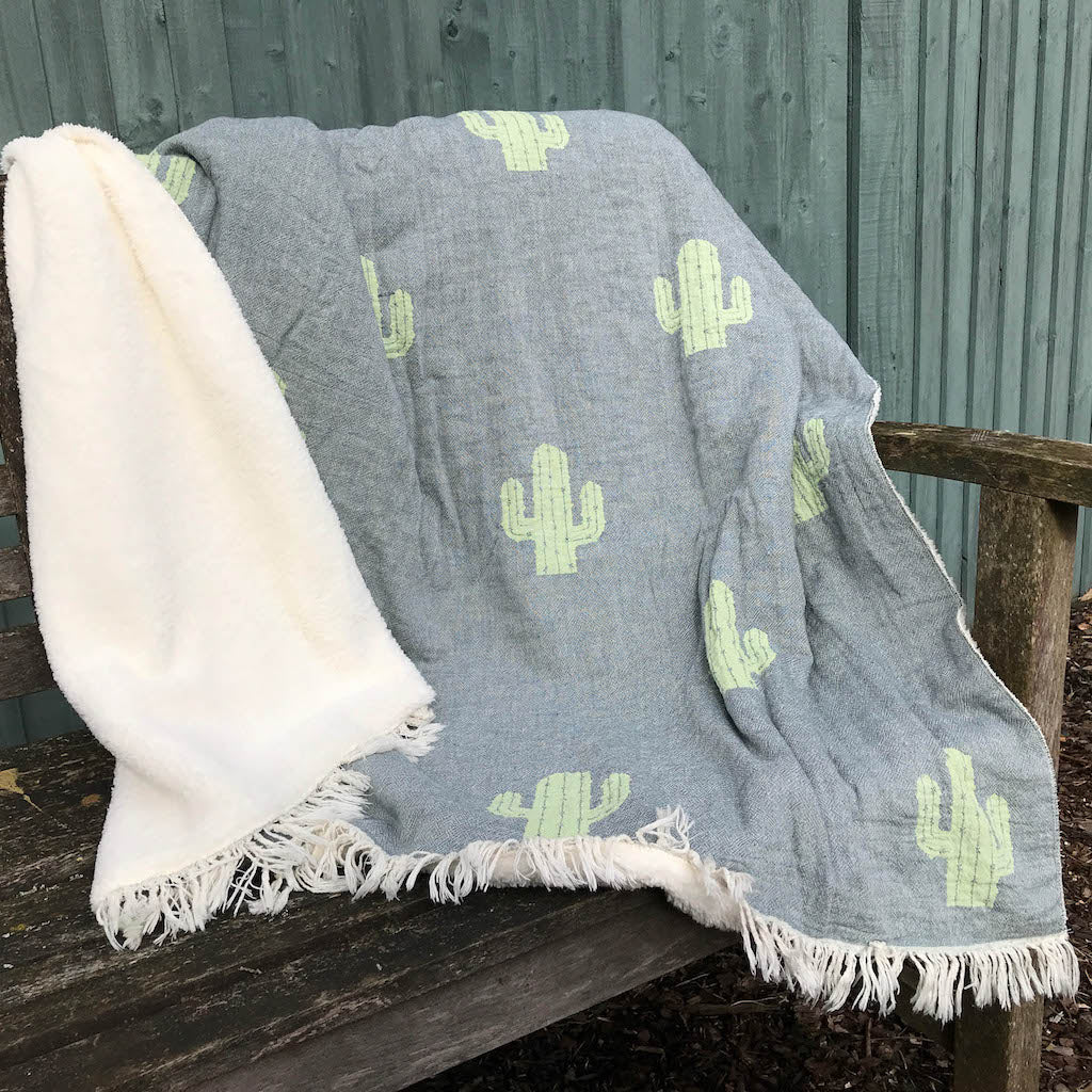 Cactus fleece lined throw on bench