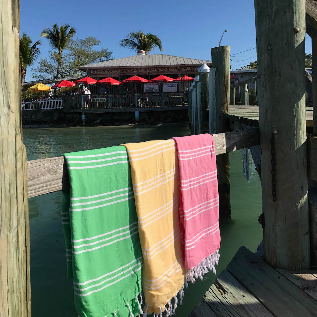 perim hammam towels draped over wooden rail on dockside